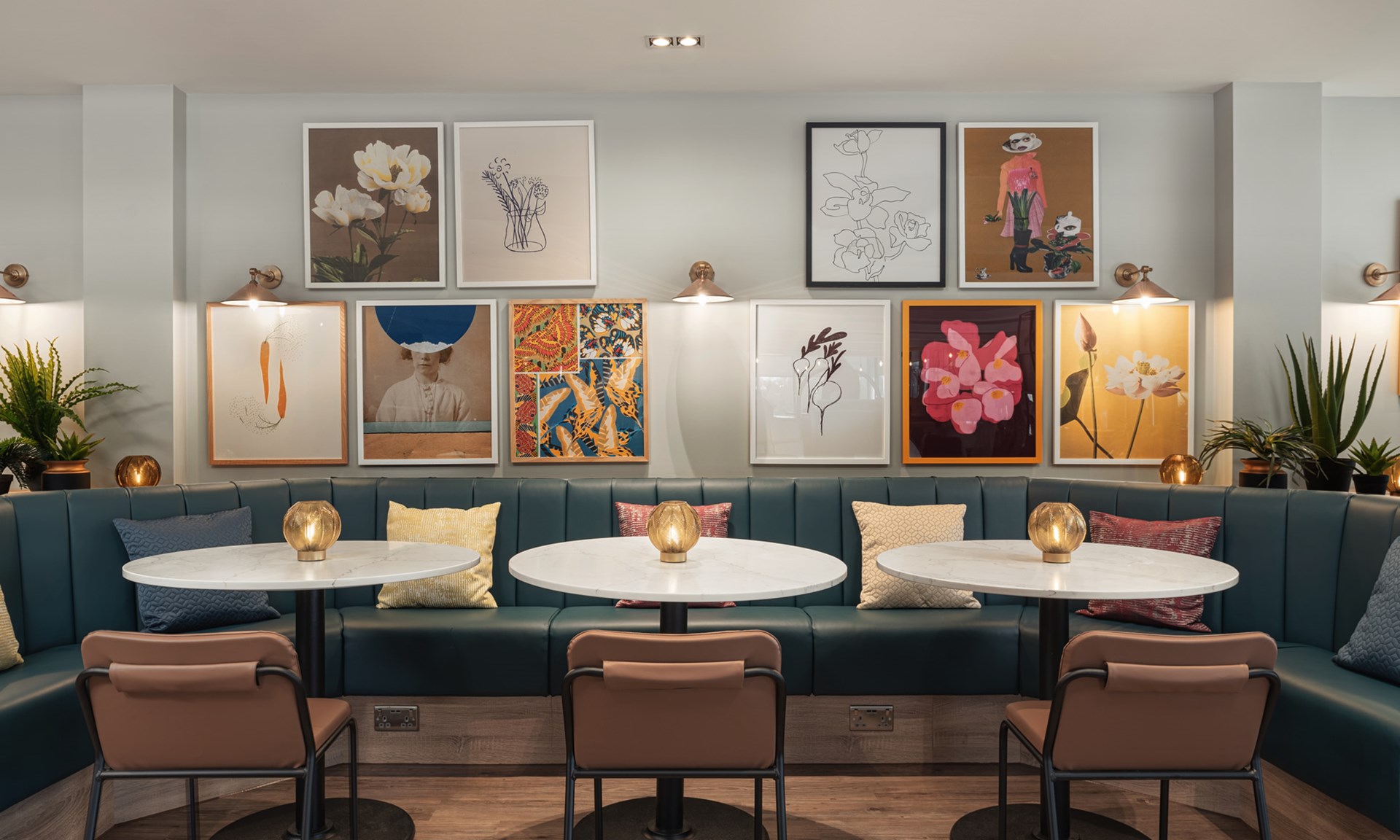 modern cafe seating with art and plants