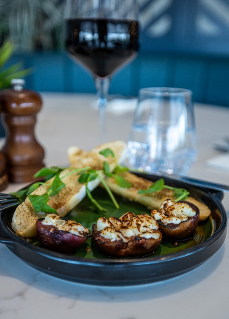 stuffed mushrooms with toasted bread and fresh greens