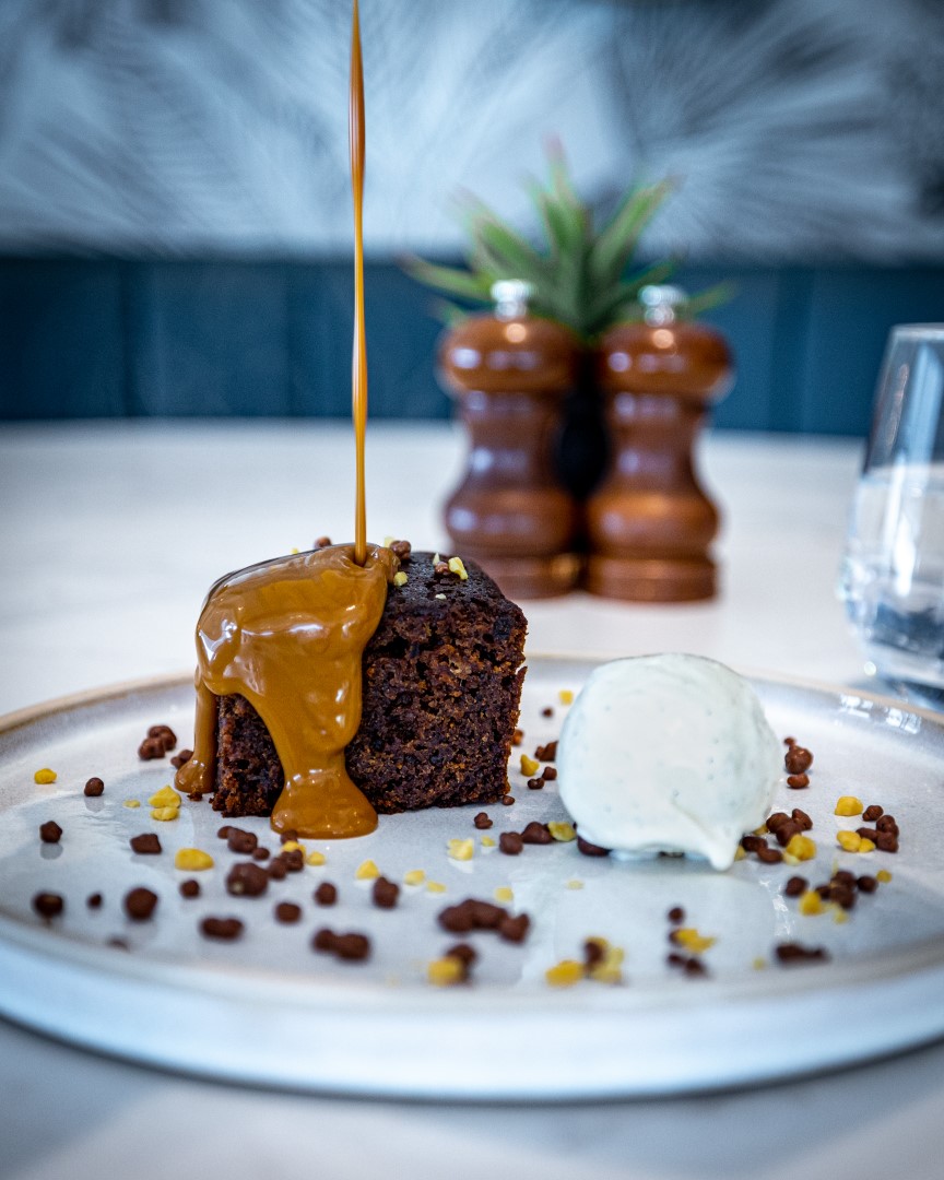 chocolate cake with caramel sauce and ice cream scoop